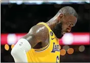  ?? JACK DEMPSEY / AP ?? Los Angeles Lakers forward LeBron James (6) looks down after a play during the second half against the Denver Nuggets on Thursday in Denver.