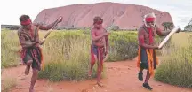  ??  ?? The Anangu Dancers carry the baton at Uluru.