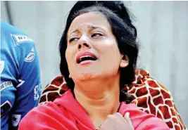  ??  ?? Relative of a victim of a train accident at Jodh Phatak, at Civil Hospital in Amritsar, on Saturday