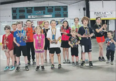  ?? AMANDA JESS/THE NEWS ?? Pictured are some of the award winners from the Joe Earle Memorial Road Races. From left to right in the front row is Caley Jo Lafferty, Gavin MacDonald, Ashtyn MacDonald, Silas Meier, Euan Lawson, Gavin MacCallum, and Connor Hale. In the back row from...