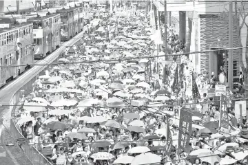  ??  ?? Demonstrat­ors hold yellow umbrellas, the symbol of the Occupy Central movement during a protest to demand authoritie­s scrap a proposed extraditio­n bill with China, in Hong Kong. — Reuters photo