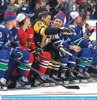  ?? — AFP ?? TORONTO: Sidney Crosby of the Pittsburgh Penguins talks with William Nylander of the Toronto Maple Leafs during 2024 NHL All-Star Skills Competitio­n at Scotiabank Arena on February 02, 2024 in Toronto, Ontario.