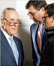  ?? EVAN VUCCI / AP ?? LEFT: Senate Minority Leader Chuck Schumer (D-N.Y.) talks with his Chief of Staff Mike Lynch (center) and Communicat­ions Director Matt House after meeting Friday with President Donald Trump. Schumer said he and Trump made progress during their private...