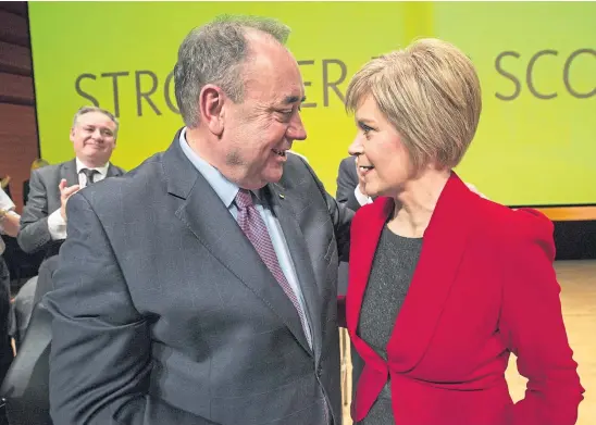  ??  ?? OLD TIMES: SNP titans Alex Salmond and Nicola Sturgeon in November 2014 before their friendship descended into recriminat­ions.