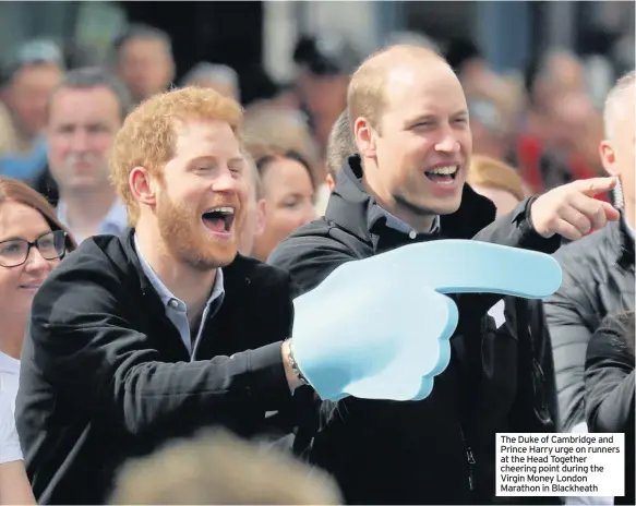  ??  ?? The Duke of Cambridge and Prince Harry urge on runners at the Head Together cheering point during the Virgin Money London Marathon in Blackheath