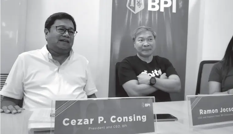  ??  ?? BANK of Philippine Islands President and Chief Executive Officer Cezar Consing and Chief Operating Officer Ramon Jocson during a press conference at the bank’s corporate center in the city.