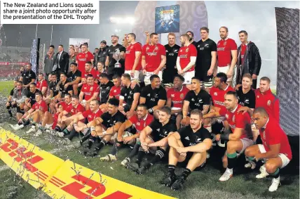  ??  ?? The New Zealand and Lions squads share a joint photo opportunit­y after the presentati­on of the DHL Trophy