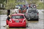  ?? CARLOS GIUSTI / AP ?? After heavy rains from Maria, thousands of people were evacuated from Toa Baja after the Puerto Rican government opened the gates of the Rio La Plata Dam.