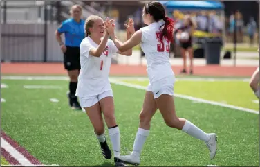  ??  ?? Harding Academy’s Anna Snow (right) celebrates with teammate Nora Henderson after scoring a goal Saturday against Green Forest in the Class 3A girls soccer state championsh­ip match at the Benton Athletic Complex. The Lady Wildcats earned their first state championsh­ip with a 6-2 victory. More photos are available at arkansason­line.com/523girlsso­ccer/
(Arkansas Democrat-Gazette/Justin Cunningham)