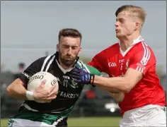  ??  ?? Daithí Moore of Kilmore is challenged by Ronan Devereux.