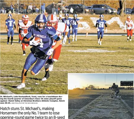  ?? JANE PHILLIPS/FOR THE NEW MEXICAN ?? St. Michael’s, Luke Kastendiec­k, front, runs for a touchdown during the fourth quarter of Saturday’s Class 4A state playoff game against Hatch Valley at Christian Brothers Athletic Complex. Hatch won 26-24.