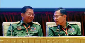  ?? AP ?? Myanmar’s Army Commander Senior General Min Aung Hlaing, left, pictured with ViceSenior General Soe Win, should be tried for genocide, a UN report recommends.