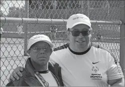  ?? PHOTO COURTESY OF LONNIE BRAXTON II ?? Lonnie Braxton III, left, and his teammate Brett Glaser of Madison at the Special Olympics USA Games in Seattle.