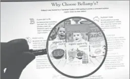  ?? YAN XIAOQING / CHINA DAILY ?? A potential buyer reads advertisem­ent for Bellamy’s organic baby formula.