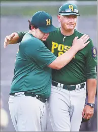  ?? Catherine Avalone / Hearst Connecticu­t Media ?? Hamden manager Ray Guarino replaces first baseman Frank Niro on July 24, 2018, in the American Legion senior state tournament at Hamden High School.