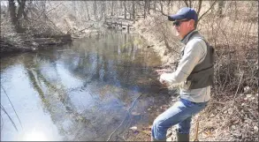  ?? Brian A. Pounds / Hearst Connecticu­t Media file photo ?? Michael Mottolese, of New Canaan, tries out a new fishing spot on the Mill River in Fairfield on March 21.