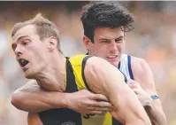  ??  ?? TOUGH: David Astbury tackled by Andrew Brayshaw.