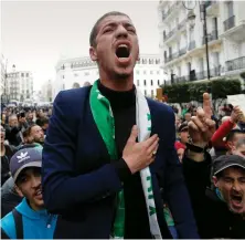  ?? AP ?? Algerian people take to the streets in Algiers to protest against the government, as the country prepares to face referendum vote on Nov. 1.