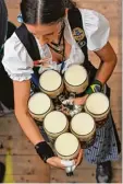  ?? (wir berichtete­n). Foto: Andreas Gebert, dpa ?? Jedes Jahr wird das Bier auf der Wiesn teurer.