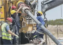  ??  ?? A drilling team prepares for work at a site to tap into an aquifer