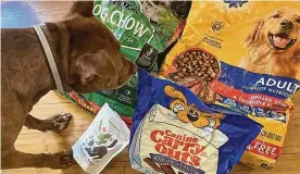  ?? LIGAYA FIGUERAS/ THE ATLANTA JOURNAL-CONSTITUTI­ON ?? Today’s dog food and treat options on the pet food aisle are quite extensive.