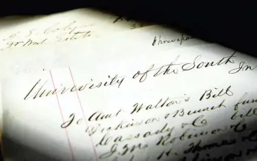  ??  ?? The University of the South has been researchin­g documents tied to its early history before the Civil War, including this accounting ledger.