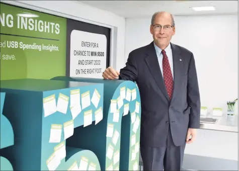  ?? Alexander Soule / Hearst Connecticu­t Media ?? Peter Scotch, director of Union Savings Bank's innovation center, inside a glass display truck touting the new USB Mobile Insights app. The Danbury-based bank is the first in the state to make the the FIS-developed artificial intelligen­ce tool available.