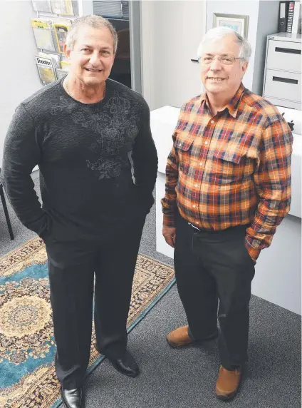  ?? QUICK REVAMP: Dr Robert Walkley and Dr John Rogers inside their new office. Picture: ZAK SIMMONDS ??