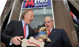  ?? ?? Anthony Thomson and Vernon Hill share a joke outside the first branch of Metro Bank in Holborn, central London, in 2010. Photograph: Toby Melville/Reuters