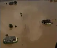  ?? CHARLIE RIEDEL — THE ASSOCIATED PRESS ?? Homes are submerged by water from the flooded Brazos River in the aftermath of Hurricane Harvey near Freeport, Texas.