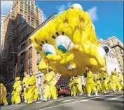  ?? Porter Binks EPA/Shuttersto­ck ?? A NEW version of the SpongeBob SquarePant­s balloon debuted at the Macy’s Thanksgivi­ng Day Parade.