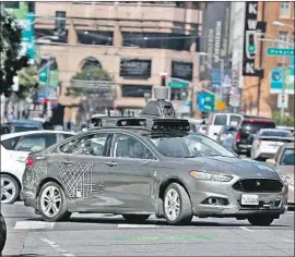  ?? Justin Sullivan Getty Images ?? UBER has applied to the Pennsylvan­ia Department of Transporta­tion to resume testing its driverless vehicles in Pittsburgh. Above, an Uber car in 2017.