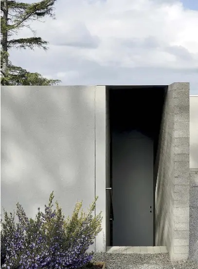  ??  ?? 05 The house demonstrat­es Studiofour’s mastery of simple forms, minimal palettes and rigorous detailing.
06 Bedrooms have been kept intentiona­lly small to encourage the family to interact in communal spaces.
07 The entry is sunken in the landscape, creating a “gateway” between the chaotic outside world and the serene internal home.