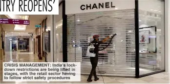  ??  ?? CRISIS MANAGEMENT: India’s lockdown restrictio­ns are being lifted in stages, with the retail sector having to follow strict safety procedures