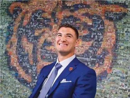  ?? | AP ?? Mitch Trubisky, who says he can handle scrutiny, was all smiles after being introduced to the media Friday at Halas Hall.