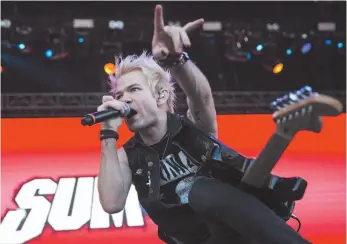  ?? AP FILE PHOTO ?? Deryck Whibley of the Canadian rock band Sum 41 performs during the concert at the 24th Sziget (Island) Festival on Shipyard Island, Northern Budapest, Hungary in 2016.