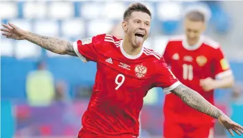  ?? — THE ASSOCIATED PRESS ?? Russia’s Fyodor Smolov celebrates after scoring his side’s second goal during their Confederat­ions Cup match against New Zealand on Saturday.