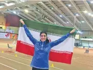  ??  ?? iriaaf.ir Iran’s Sepideh Tavakoli holds aloft Iranian flag, celebratin­g her gold medal in the women’s pentathlon at the Asian Indoor Athletics Championsh­ips in Tehran, Iran, on February 3, 2018.