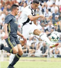  ?? AP ?? In this Sunday, August12, 2018 ,photograph, Juventus’ Cristiano Ronaldo (right) controls the ball during a friendly match between the Juventus A and B teams, in Villar Perosa, northern Italy.