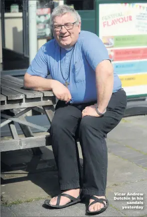  ?? Picture: ARCHANT ?? Vicar Andrew Dotchin in his
sandals yesterday