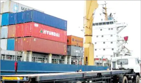  ?? HENG CHIVOAN ?? A truck prepares to receive shipping containers at the Sihanoukvi­lle Autonomous Port on the Kingdom’s coast.