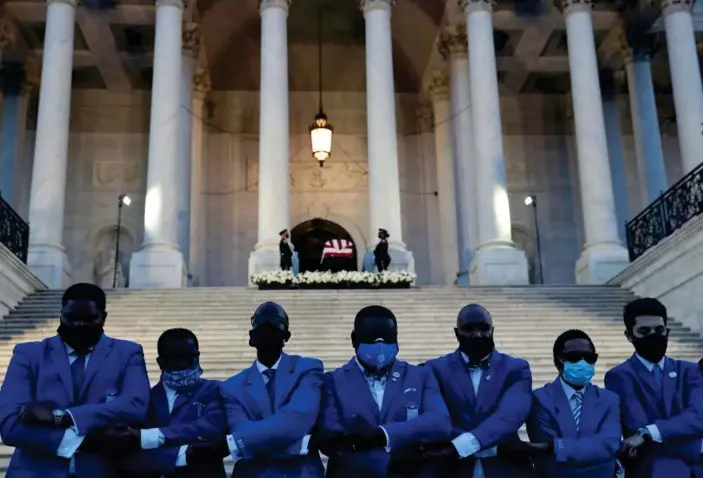 ?? Photograph: Leah Millis/Reuters ?? Members of Phi Beta Sigma Fraternity, to which John Lewis belonged, sing their fraternity hymn outside the Capitol on Monday.