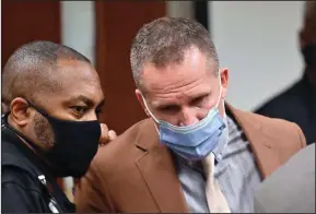  ?? (AP/Timothy D. Easley) ?? A Jefferson County Sheriff (left) speaks with former Louisville Police officer Brett Hankison Thursday before leaving the courtroom following his acquittal on three counts of wanton endangerme­nt.