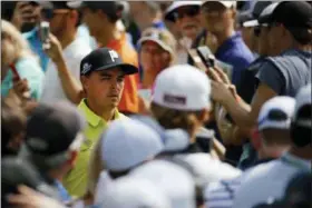  ?? CHARLIE RIEDEL — THE ASSOCIATED PRESS ?? Rickie Fowler walks to the sixth tee during the first round of the PGA Championsh­ip at Bellerive Country Club, Thursday in St. Louis.