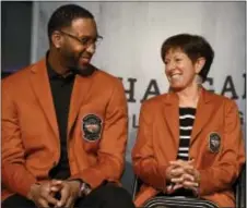  ?? JESSICA HILL — THE ASSOCIATED PRESS ?? Two inductees into the Naismith Memorial Basketball Hall of Fame, Tracy McGrady, left, and Muffet McGraw, share a greeting Thursday during a news conference. McGraw, 61, the longtime Notre Dame head coach, is a graduate of Bishop Shanahan High and St....