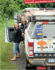  ??  ?? ABOVE A pitstop for Carla and friends Thomas, Shannon, Graeme and Peter in the magnificen­t Kigezi Game Reserve in Uganda; a gorilla in Bwindi Impenetrab­le Forest gets a closer look at Shannon – it took four hours of hiking with David Agenya (pictured...