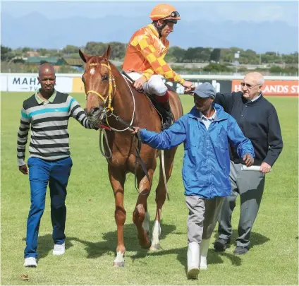  ?? Picture: Wayne Marks ?? ORANGE ALERT. Billy Prestage and his team greet jockey Gavin Lerena and Milton after their shock victory in last year’s World Sports Betting Premier Trophy.