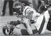  ?? Brett Coomer / Staff photograph­er ?? Jadeveon Clowney, top, is given the freedom in the Texans’ defense to earn face time with quarterbac­ks like Case Keenum.