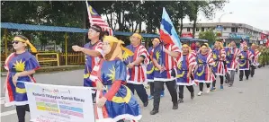  ??  ?? (Gambar kanan) KONTINJEN Komuniti 1Malaysia.