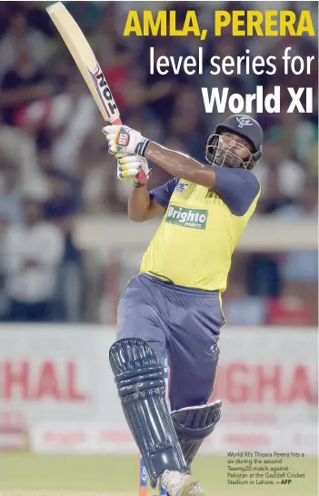  ?? — AFP ?? World XI’s Thisara Perera hits a six during the second Twenty20 match against Pakistan at the Gaddafi Cricket Stadium in Lahore.